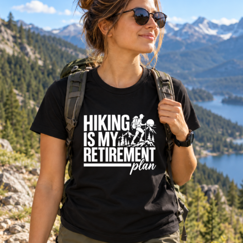 Black hiking shirt with Hiking Is My Retirement Plan text and mountain hiker graphic